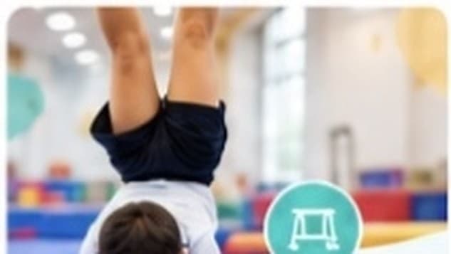 Young gymnast working on technique with a coach