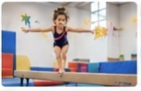 Young gymnast practising flexibility and balance